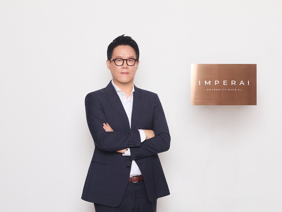 ImperAI CEO Ben Eum beside the IMPERAI signage